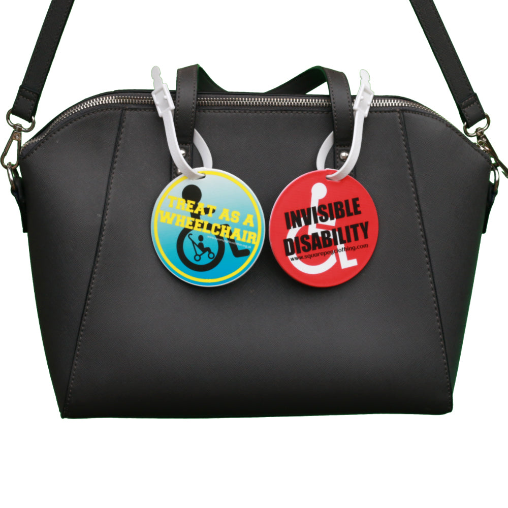 square_peg_invisible_disability_and_treat_as_wheelchair_user_badge_clips_on_bag